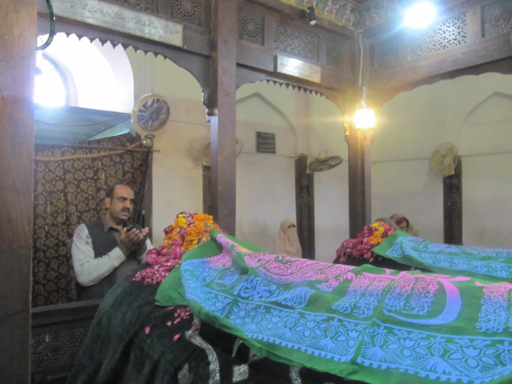 A man prays at the shrine of Bahauddin Zakariya in the Multan fort.